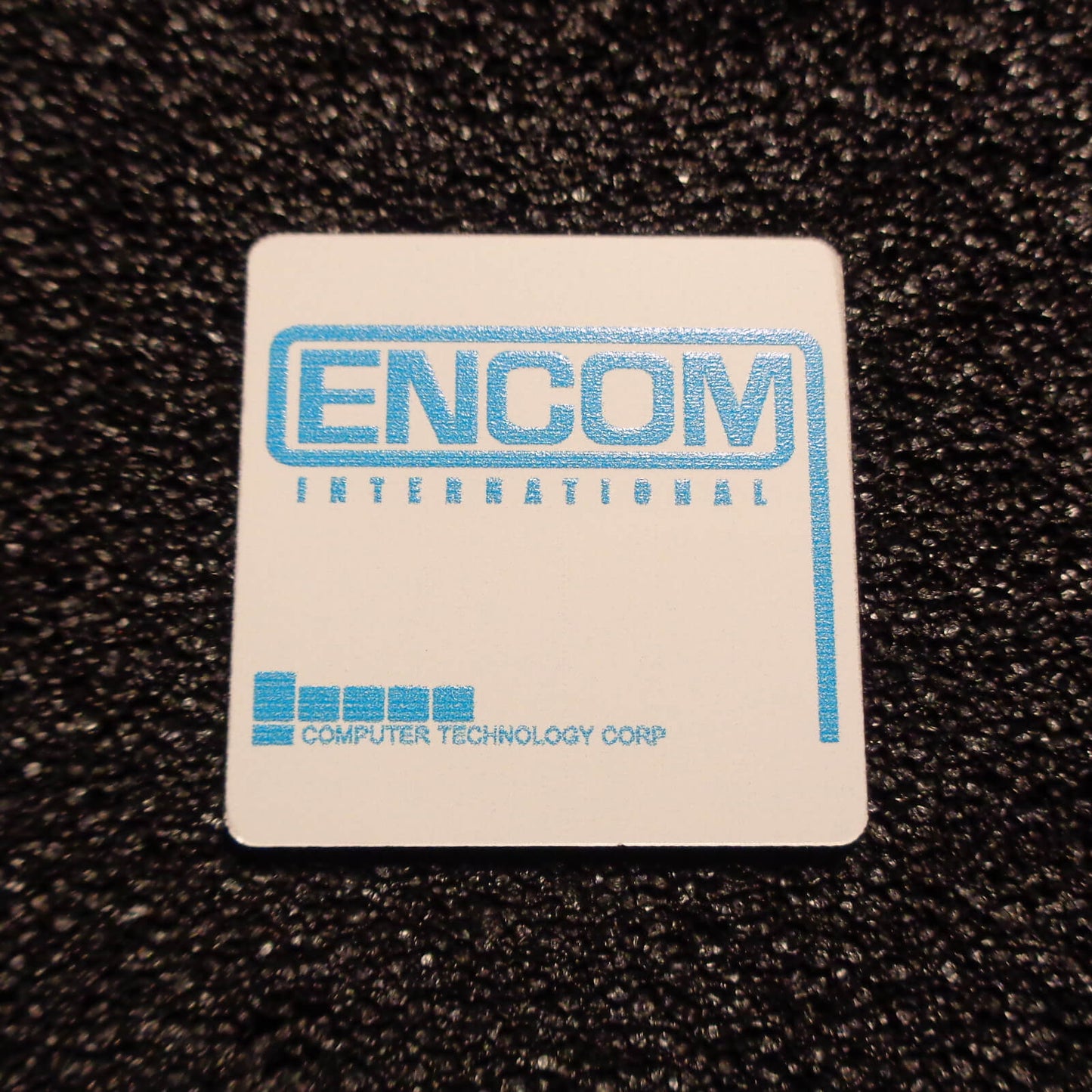 Encom International Corporation badge
