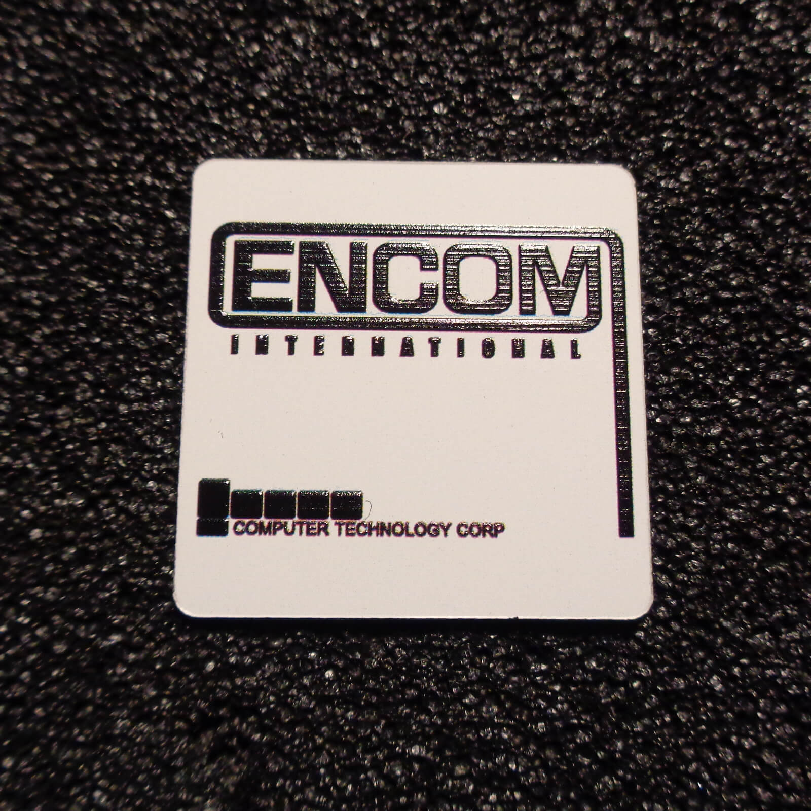 Encom International Corporation Logo